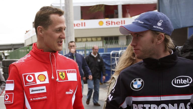 Nick Heidfeld (re.) kritisiert den Fahrstil des siebenmaligen Weltmeisters Michael Schumacher (li.)
