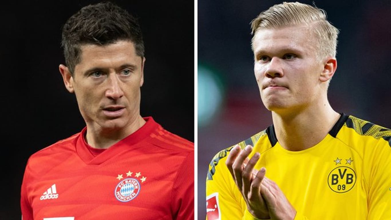 Bayern Münchens Robert Lewandowski (l) und Erling Haaland von Borussia Dortmund treffen am Dienstag aufeinander.
