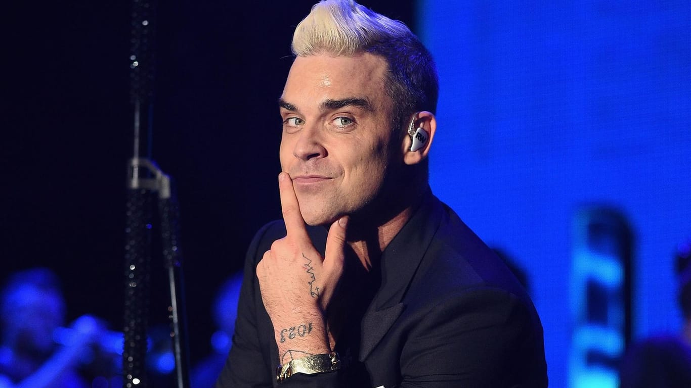 Robbie Williams: 2011 verließ er die Band zum zweiten Mal.