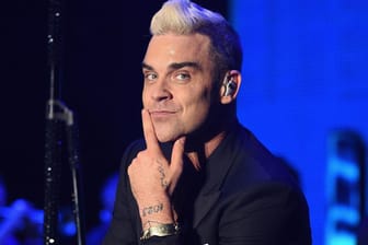 Robbie Williams: 2011 verließ er die Band zum zweiten Mal.