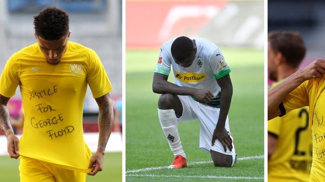 Jadon Sancho (l) trägt ein Trikot mit dem Schriftzug "Justice for George Floyd". Jadon Sancho (l) trägt ein Trikot mit dem Schriftzug "Justice for George Floyd".