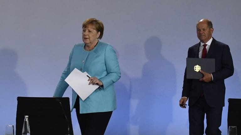 Kanzlerin Angela Merkel (CDU) und Finanzminister Olaf Scholz (SPD).