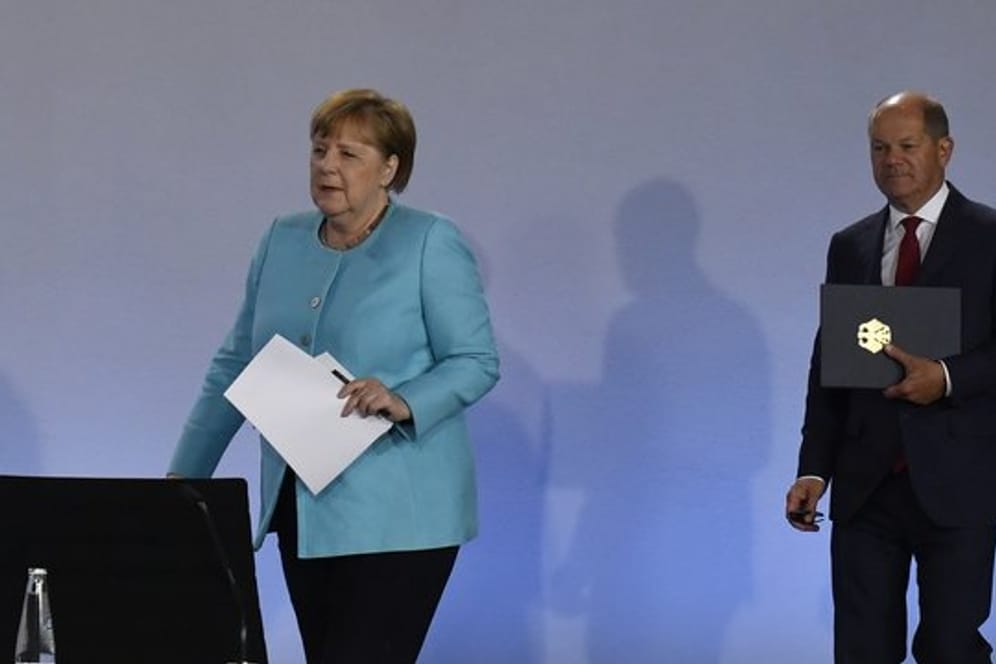 Kanzlerin Angela Merkel (CDU) und Finanzminister Olaf Scholz (SPD).