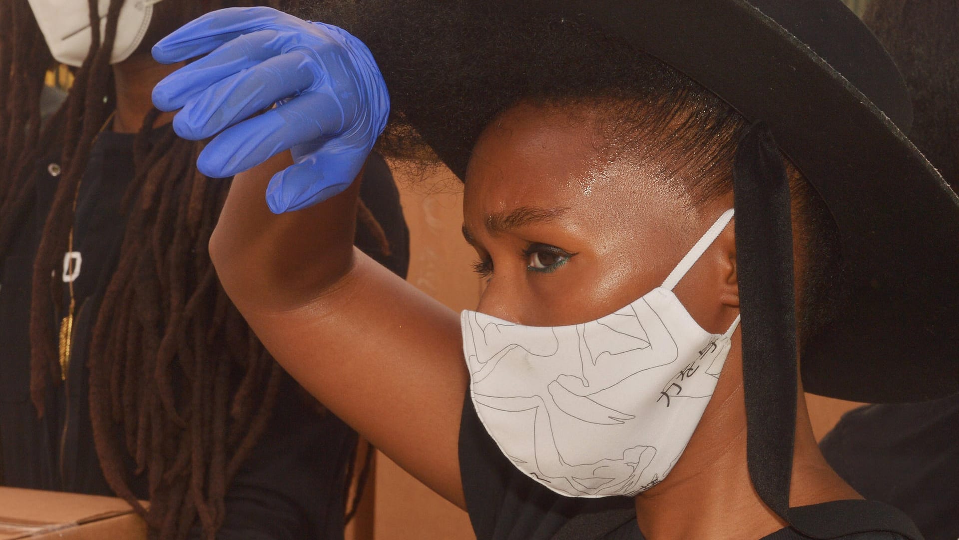 Singer and actress Janelle Monae helps distribute fresh food to families that have been impacted by the coronavirus pand