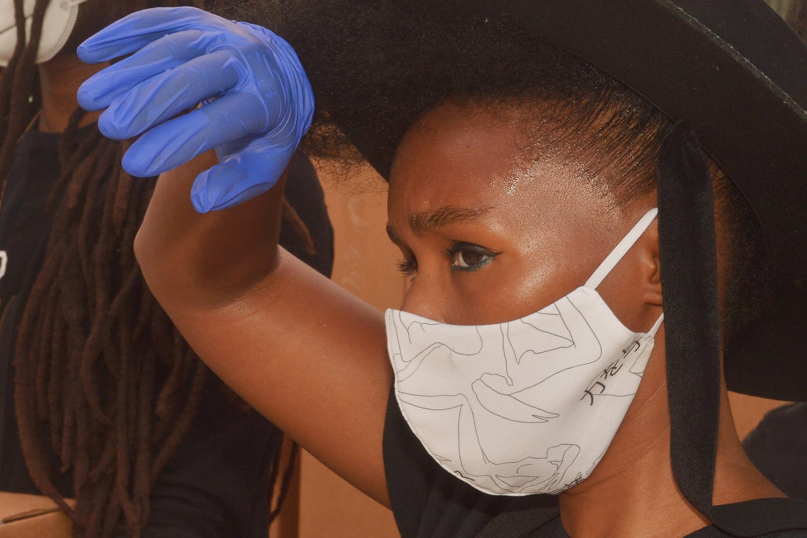 Singer and actress Janelle Monae helps distribute fresh food to families that have been impacted by the coronavirus pand