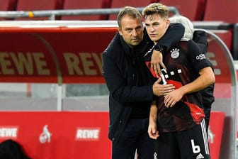 Joshua Kimmich (r.) neben Hansi Flick: Wenn es nach dem Bayern-Spieler geht, wird Flick Bundestrainer.