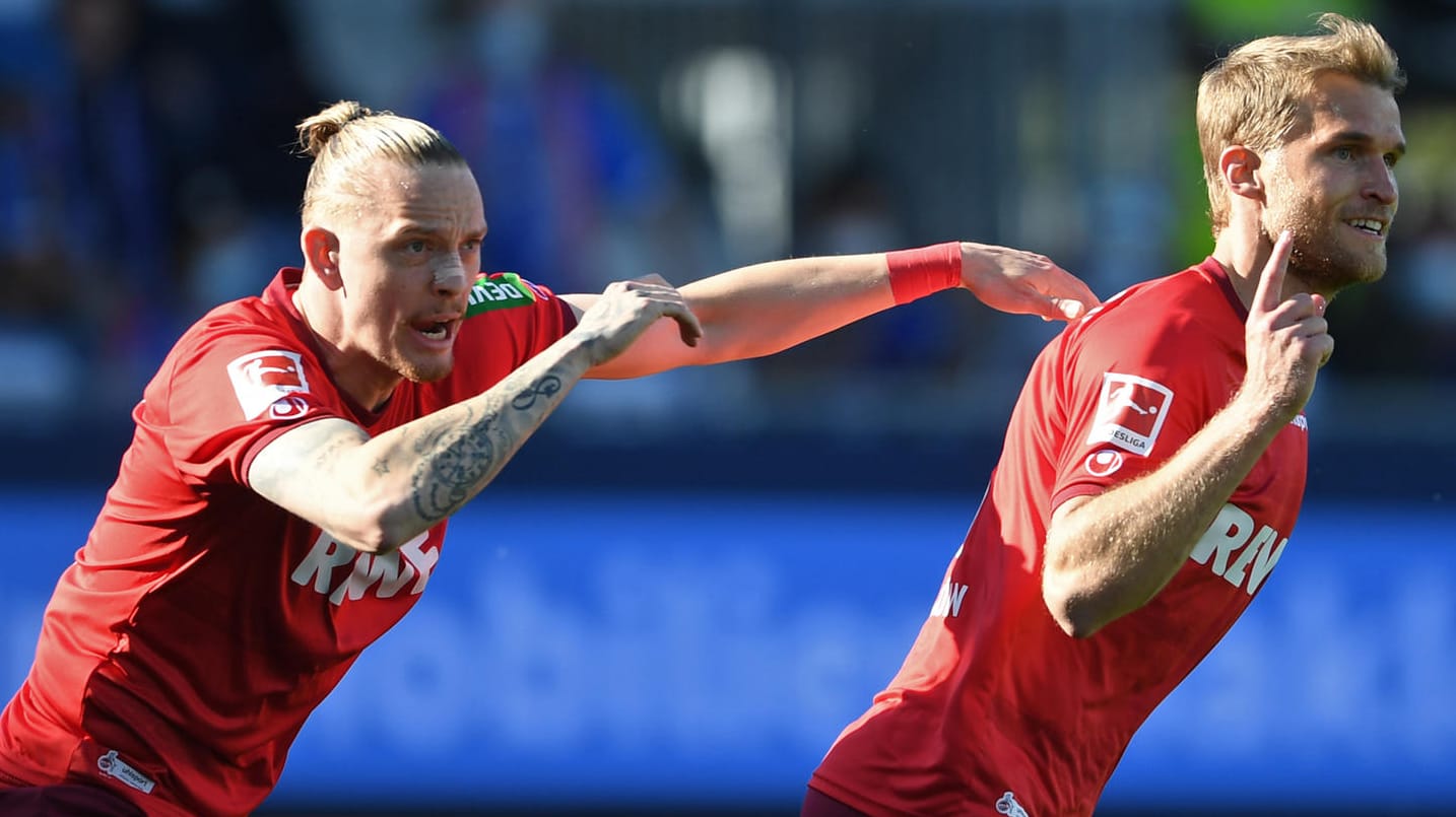 Marius Wolf (l.) feiert Torschütze Sebastian Andersson: Die "Effzeh"-Spieler schafften den Klassenerhalt durch die Relegation. Marius Wolf (l.) feiert Torschütze Sebastian Andersson: Die "Effzeh"-Spieler schafften den Klassenerhalt durch die Relegation.