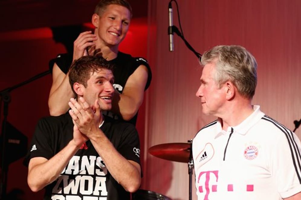 Holten mit dem FC Bayern 2013 das Triple: Thomas Müller (l) und Jupp Heynckes.