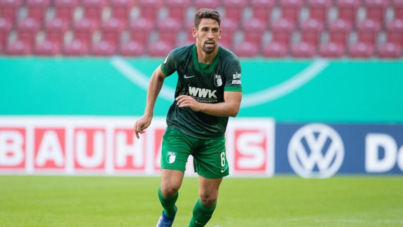 "Ich glaube, wir können ihn im Verbund stoppen", sagt Augsburgs Rani Khedira vor dem Duell mit Erling Haaland und dem BVB.