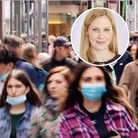 Menschen mit Masken in einer FuÃŸgÃ¤ngerzone: Innerhalb von Einkaufszentren halten sich viele nicht an die Maskenpflicht