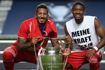 Jerome Boateng und David Alaba (v.l.): Bei einer Titelverteidigung in der Königsklasse würden die Bayern-Stars weniger Siegprämie kassieren.