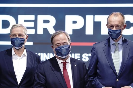 Die Kandidaten für den Bundesvorsitz der CDU, Norbert Röttgen (L), Armin Laschet und Friedrich Merz (R).