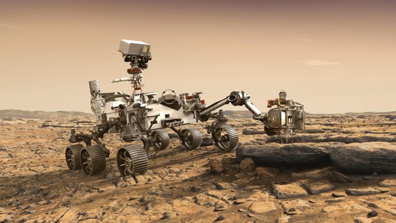 Eine grafische Darstellung zeigt den Nasa-Rover "Perseverance" auf der Marsoberfläche im Einsatz bei der Untersuchung von Gestein.