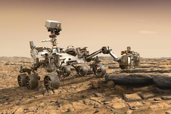 Eine grafische Darstellung zeigt den Nasa-Rover "Perseverance" auf der Marsoberfläche im Einsatz bei der Untersuchung von Gestein.