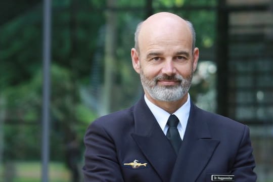 Dr.