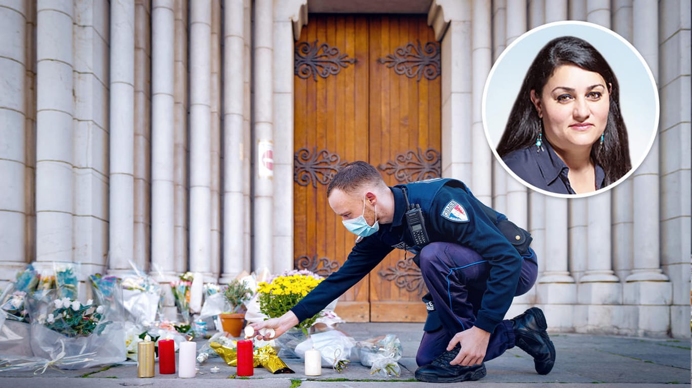 Ein Polizist zündet vor der Kathedrale in Nizza eine Kerze an: Hier wurden drei Menschen von einem mutmaßlichen Islamisten ermordet.