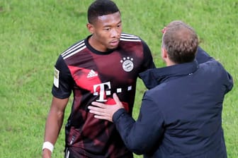Zwei Bayern-Protagonisten: Es erscheint unklarer denn je, dass David Alaba (l.) und Trainer Hansi Flick auch in der nächsten Saison zusammenarbeiten.