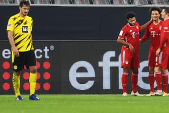 Gefühlswelten: BVB-Verteidiger Hummels (l.) ist enttäuscht, Bayerns Gnabry, Sané und Lewandowski feiern.