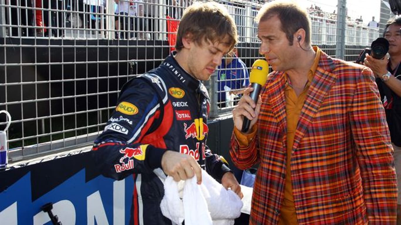 Gesichert der Formel 1: Sebastian Vettel (l) und Kai Ebel im Jahr 2011.
