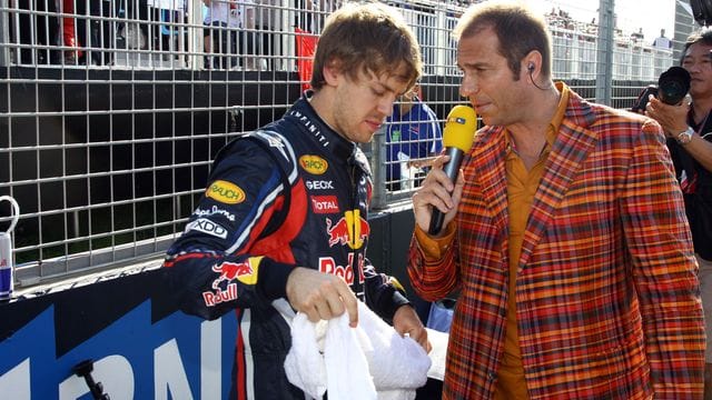 Gesichert der Formel 1: Sebastian Vettel (l) und Kai Ebel im Jahr 2011.