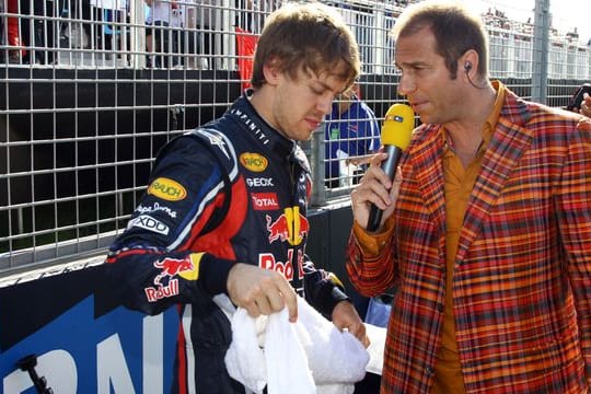 Gesichert der Formel 1: Sebastian Vettel (l) und Kai Ebel im Jahr 2011.