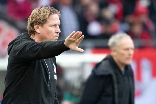 Hat eine hohe Meinung von Freiburg-Trainer Christian Streich (hinten): Kölns Markus Gisdol.
