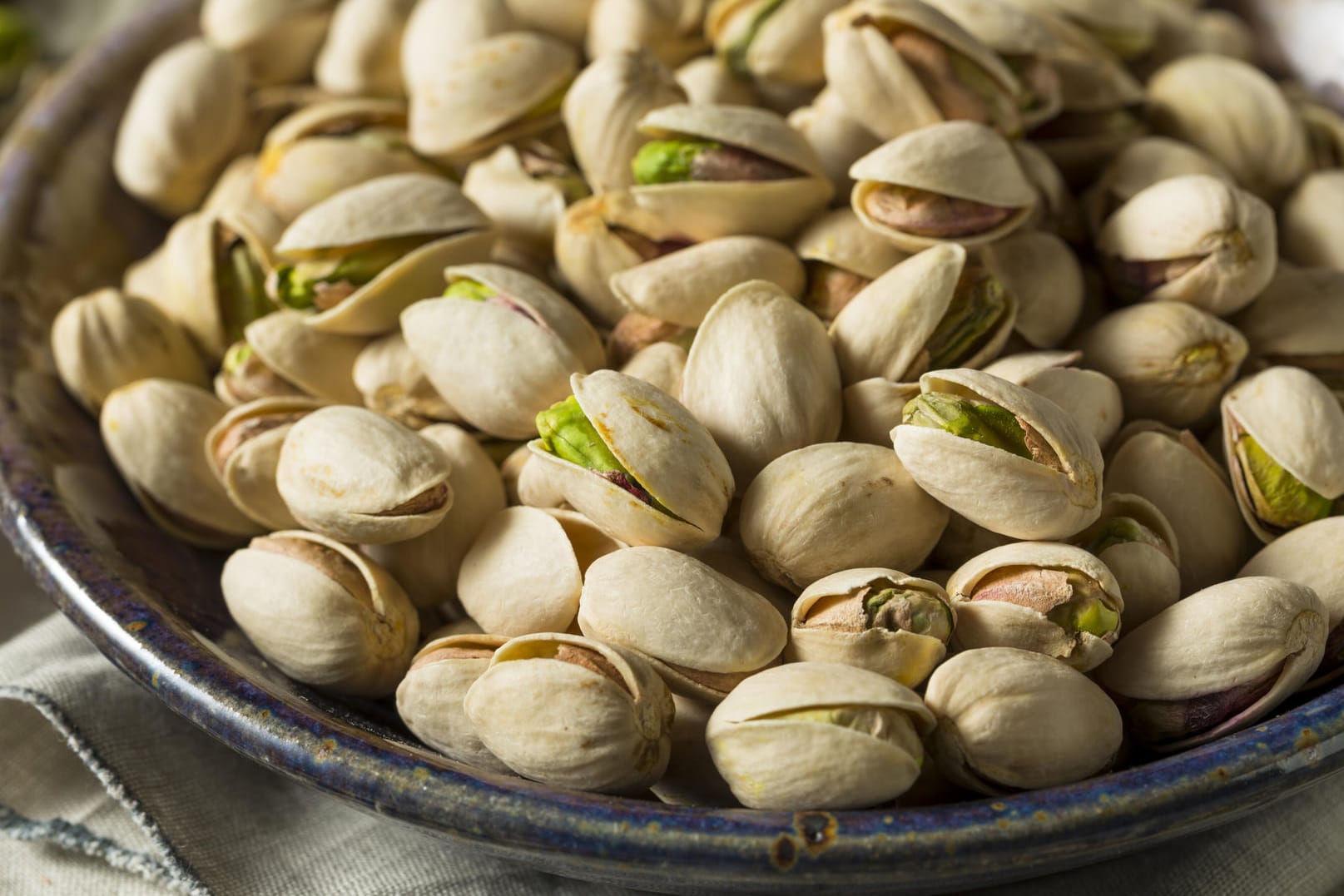 Raw Organic Green Fresh Pistachios in a Bowl (bhofack2)