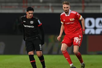 Nadiem Amiri (l.): Der Bayer-Spieler hat die Entschuldigung des Kickers von Union Berlin angenommen.
