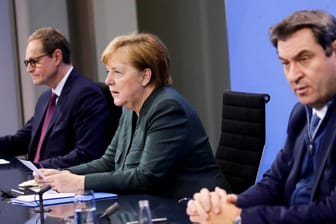 Michael Müller, Angela Merkel und Markus Söder: Nach langen Verhandlungen erklären sie die neuen Corona-Maßnahmen.