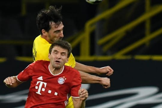 Die Sommerspiele 2021 in Tokio finden ohne den ehemaligen Fußball-Weltmeister Thomas Müller (vorn, im Duell mit Mats Hummels) statt.