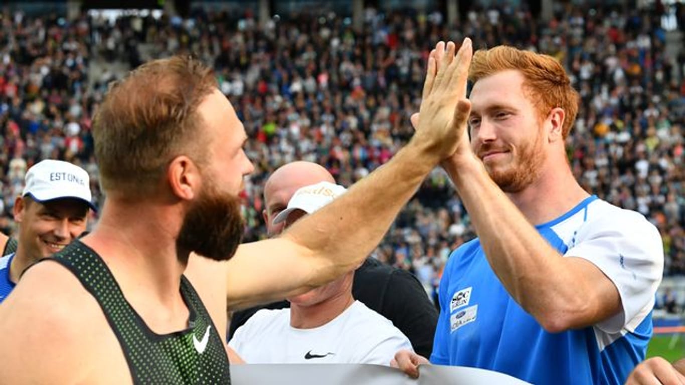 Die Brüder Robert (l) und Christoph Harting haben sich wieder angenähert.