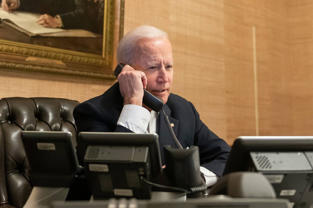 February 18, 2021 - Washington, District of Colombia, USA - President Joe Biden talks on the phone with Texas Gov. Greg