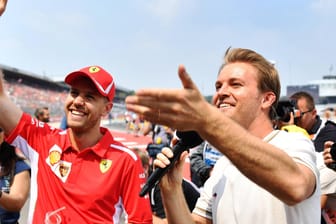 Sebastian Vettel und Nico Rosberg (r.): Der ehemalige Weltmeister Rosberg glaubt an ein Ende der Vettel-Krise.