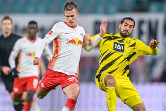 Treffen im Pokalfinale aufeinander: Leipzigs Dani Olmo (l.) und Dortmunds Emre Can.