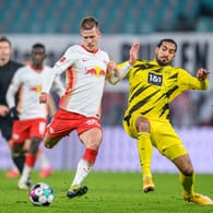 Treffen im Pokalfinale aufeinander: Leipzigs Dani Olmo (l.) und Dortmunds Emre Can.