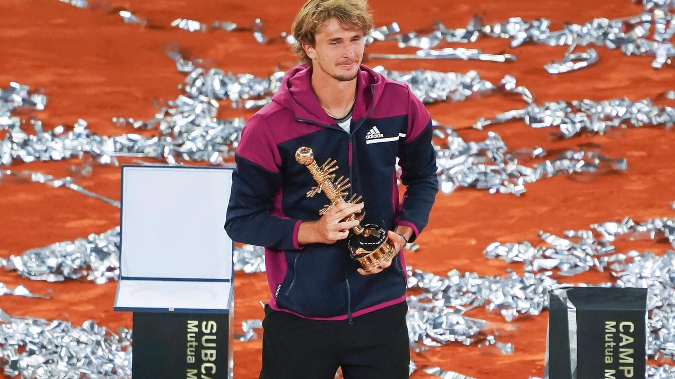 Mutua Madrid Open - Day Eleven Alexander Zverev of Germany celebrates with the trophy following victory against Matteo B