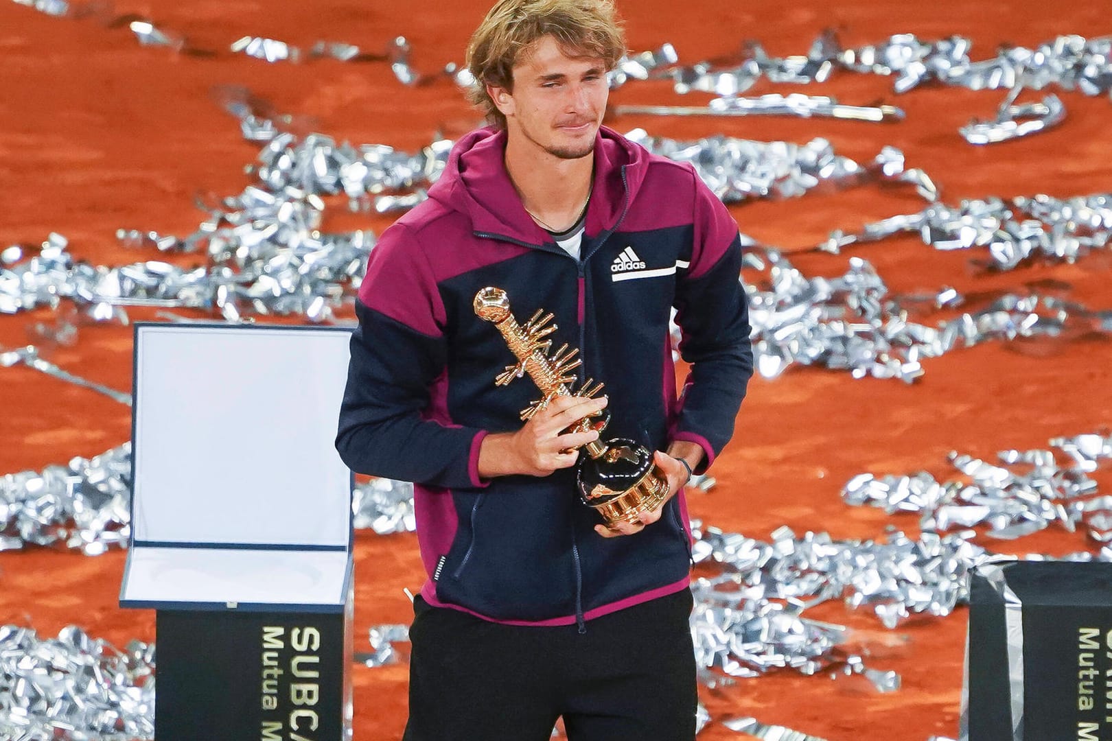 Mutua Madrid Open - Day Eleven Alexander Zverev of Germany celebrates with the trophy following victory against Matteo B