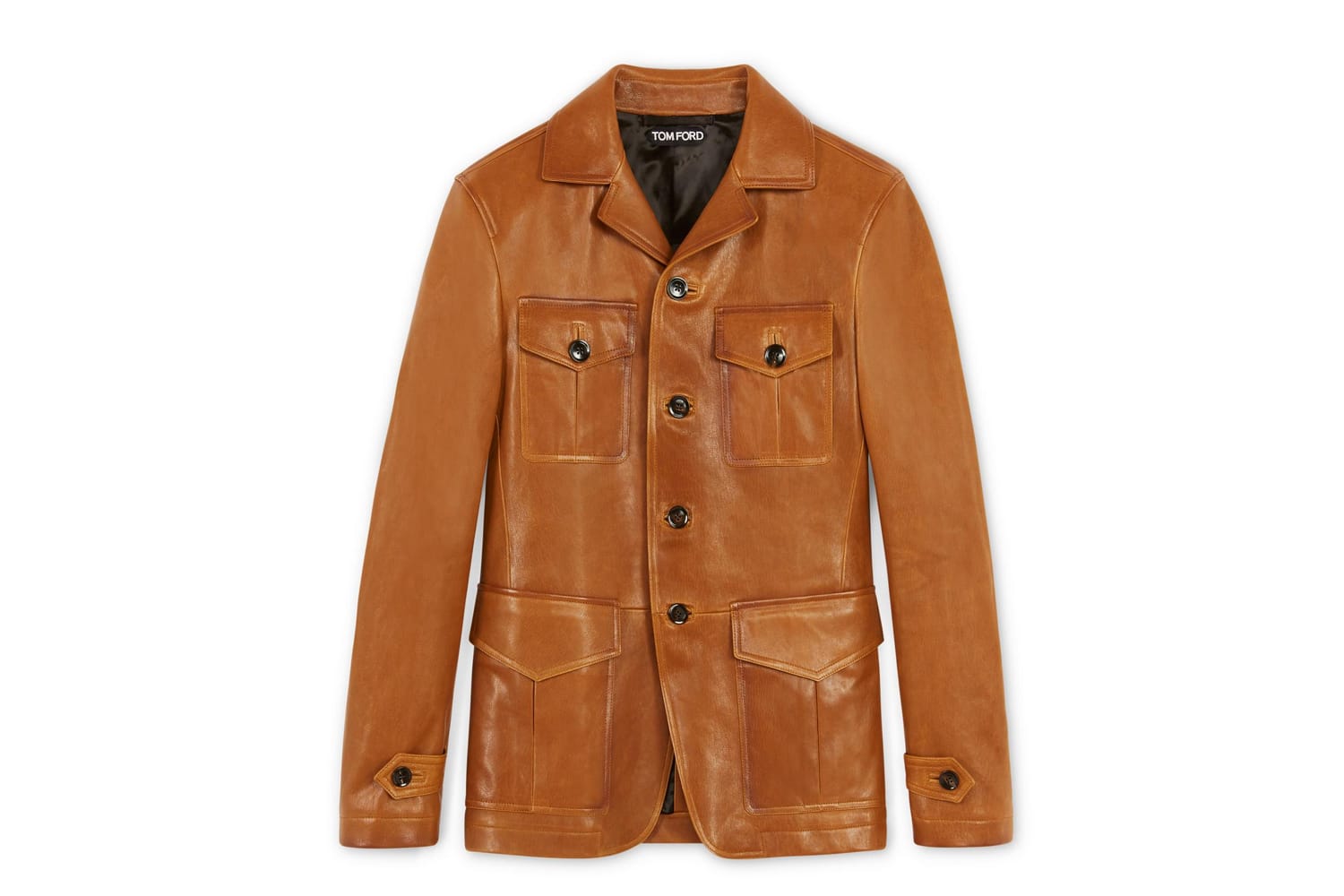 Ein paar Nuancen wärmer, weiches Nappaleder und im Military Stil: Die Lederjacke von Tom Ford besticht durch sommerlich warmes Braun (um 5.000 Euro).