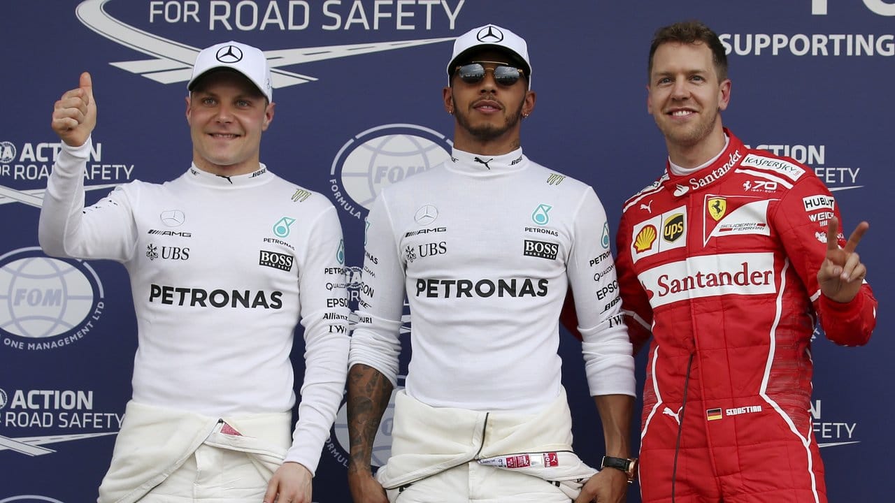Hinter Hamilton werden Vettel (r) und Valtteri Bottas (l) starten.