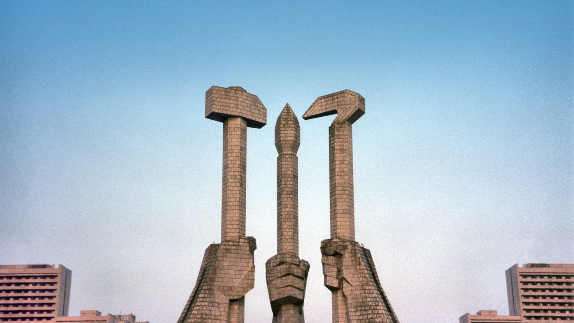 North Korea, Pyongyang: Party symbol in stone