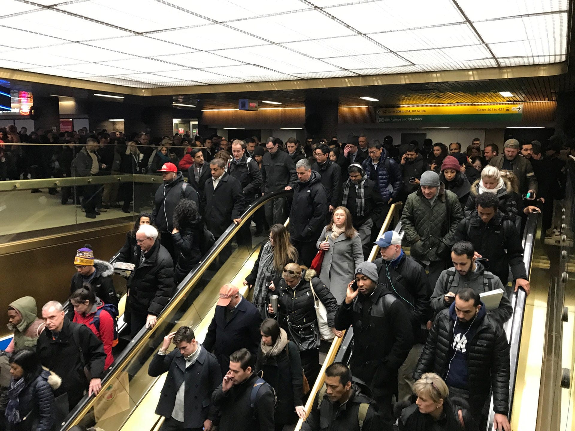 Commuters exit the New York Port Authority in New York City after reports of an explosion