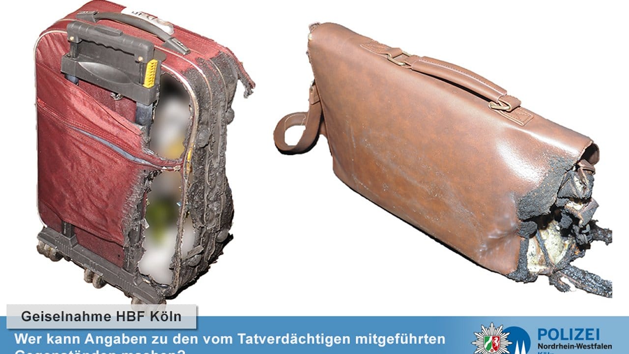 Nach der Geiselnahme im Kölner Hauptbahnhof sucht die Polizei Hinweise zu einem roten Rollen-Koffer und einer braunen Umhängetasche. Nach der Geiselnahme im Kölner Hauptbahnhof sucht die Polizei Hinweise zu einem roten Rollen-Koffer und einer braunen Umhängetasche.