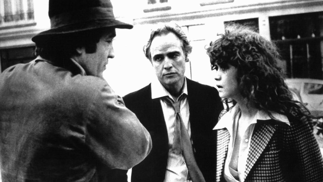Regisseur Bernardo Bertolucci (l) im Gespräch mit seinen Hauptdarstellern Marlon Brando (M) und Maria Schneider bei den Dreharbeiten zu "Der letzte Tango in Paris" 1972. Regisseur Bernardo Bertolucci (l) im Gespräch mit seinen Hauptdarstellern Marlon Brando (M) und Maria Schneider bei den Dreharbeiten zu "Der letzte Tango in Paris" 1972.