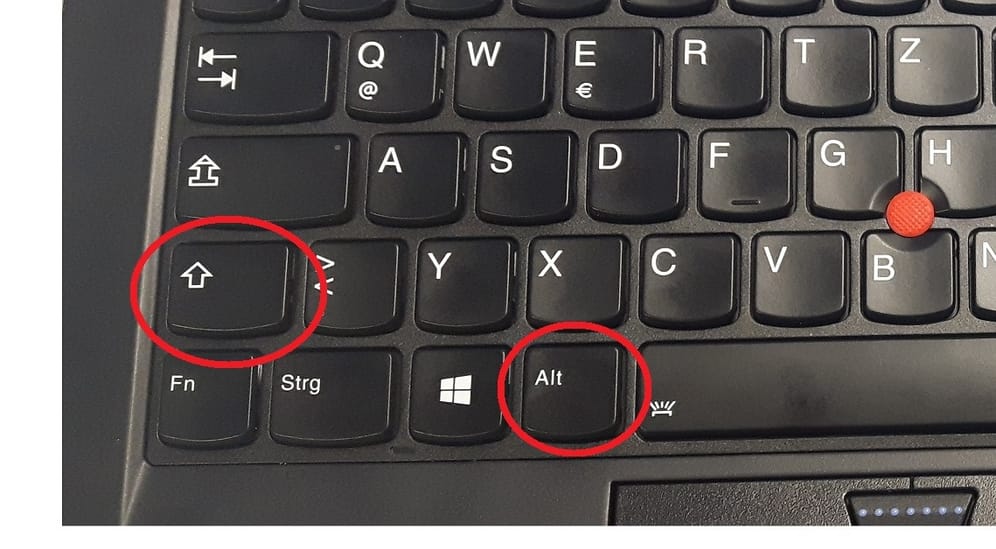 Unter Windows 7 müssen Sie zum Umstellen des Tastaturlayouts Alt-Taste und Tabulator drücken.