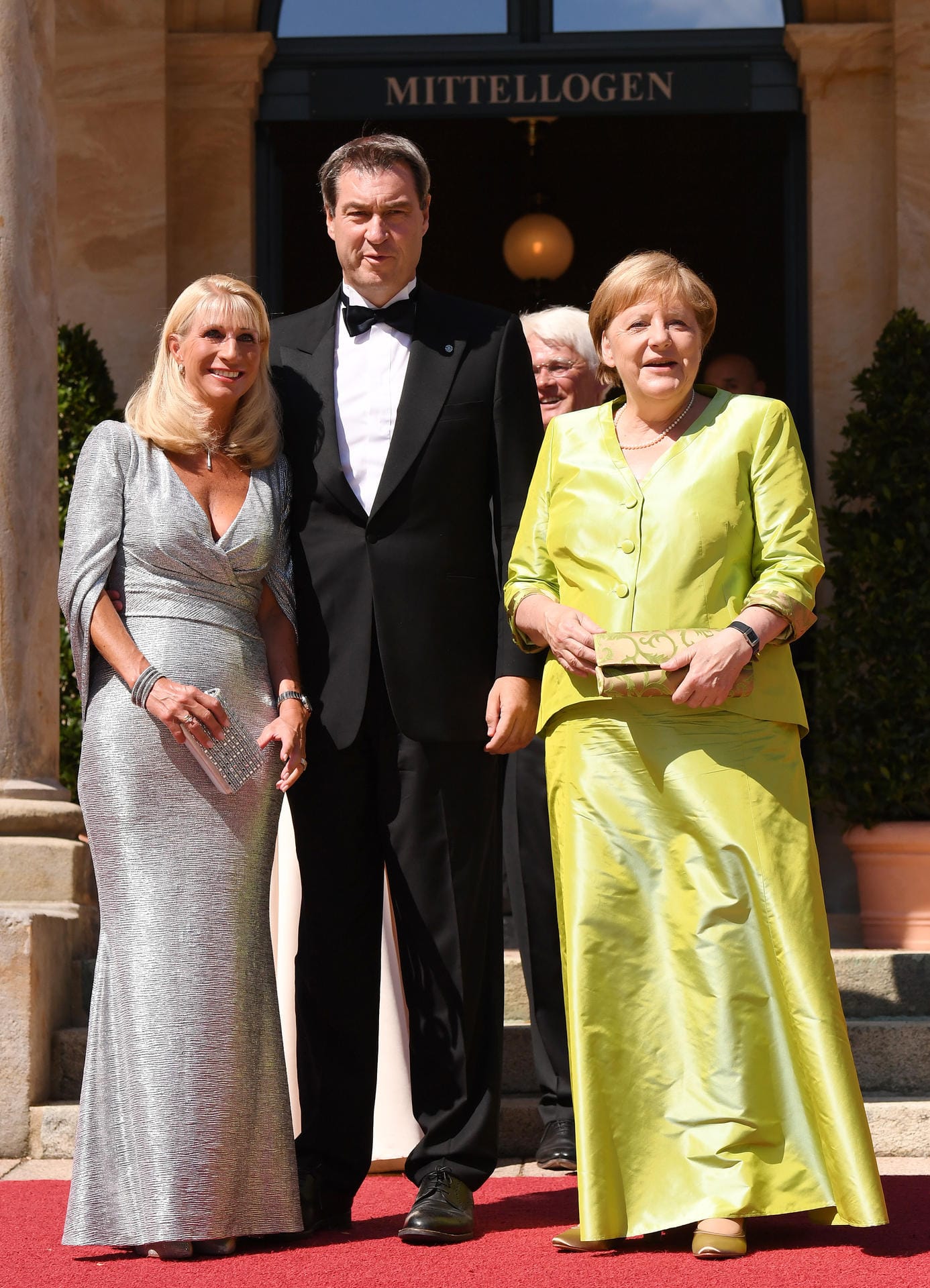Karin Baumüller-Söder, der bayerische Ministerpräsident Markus Söder und Bundeskanzlerin Angela Merkel