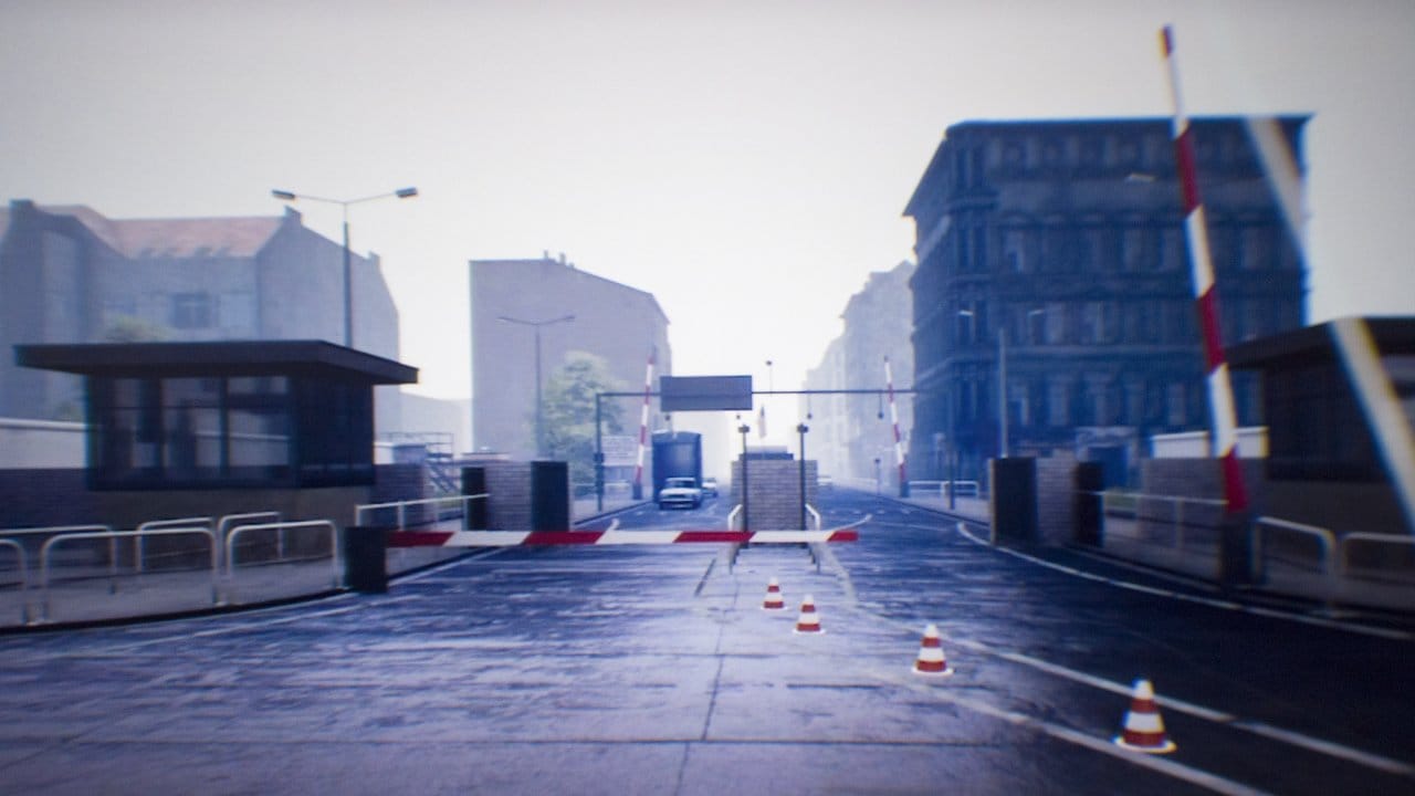 Ein Grenzübergang ist bei einer virtuellen Zeitreise in das geteilte Berlin in einer Virtual-Reality-Brille zu sehen. Ein Grenzübergang ist bei einer virtuellen Zeitreise in das geteilte Berlin in einer Virtual-Reality-Brille zu sehen.