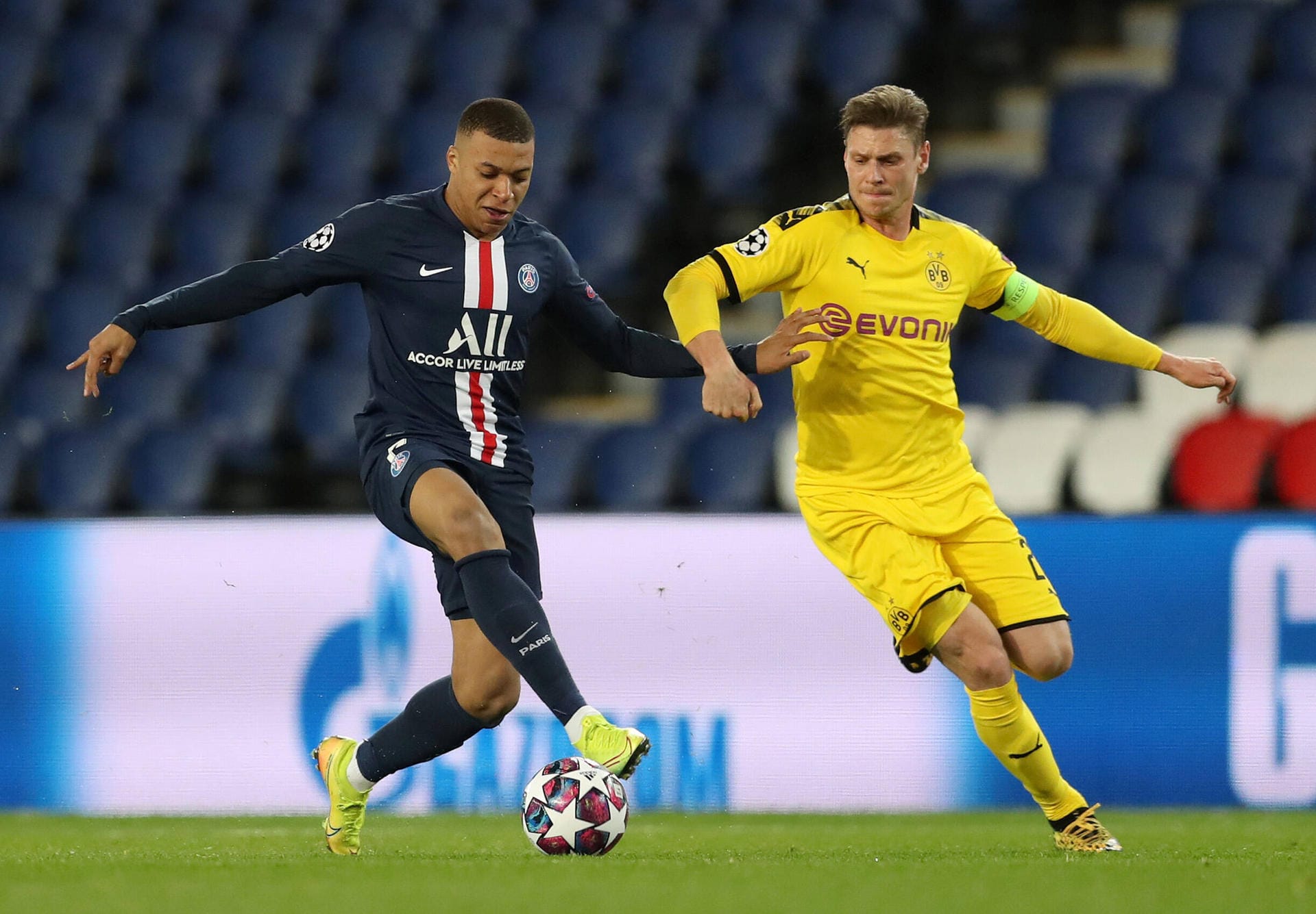 Paris St Germain s Kylian Mbappe in action with Borussia Dortmund s Lukasz Piszczek FOOTBALL : Paris St Germain v Boruss