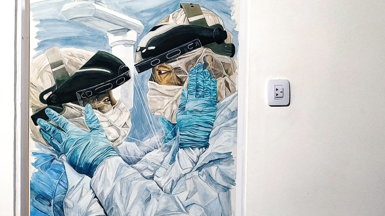 Das Bilod von Gonzalo Ferreyra zeigt zwei Mitarbeiter des Gesundheitswesens in ihrem Kampf gegen die Corona-Pandemie.