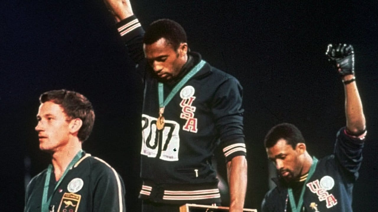 Tommie Smith (M) und John Carlos demonstrierten 1968 mit gesenkten Köpfen für die "Black Power"-Bewegung. Tommie Smith (M) und John Carlos demonstrierten 1968 mit gesenkten Köpfen für die "Black Power"-Bewegung.