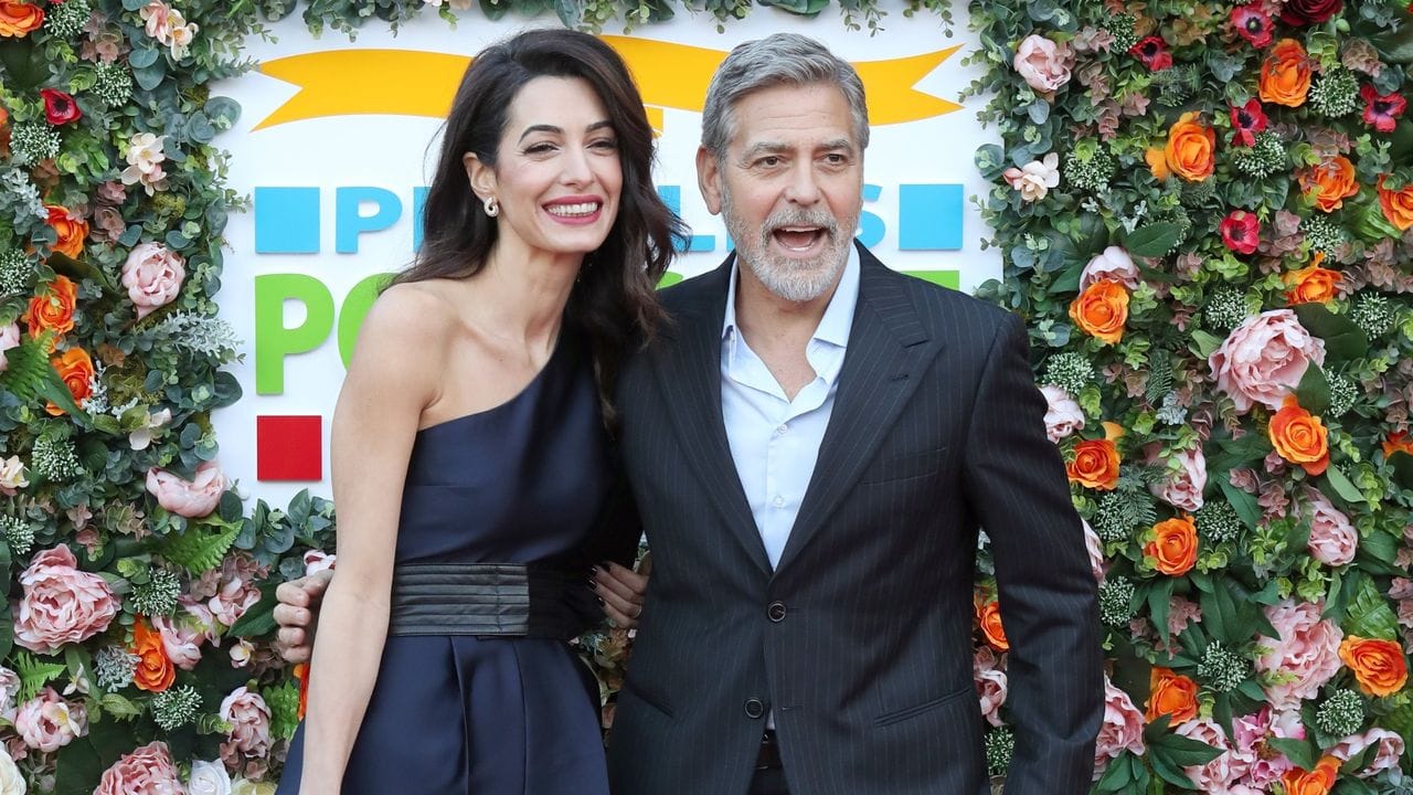 George Clooney und seine Frau Amal 2019 in Edinburgh.